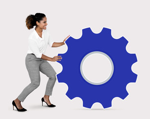 Business woman holding a cog icon