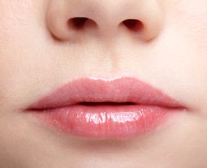 Fototapeta premium Closeup macro portrait of female part of face. Human woman lips with day beauty makeup