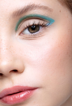 Closeup shot of  human female face. Woman with vogue face beauty makeup.