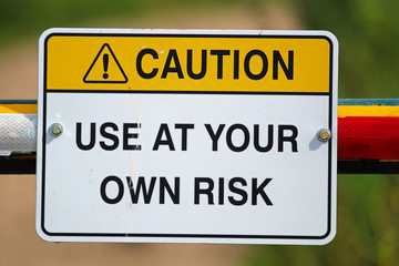 A caution use at your own risk sign