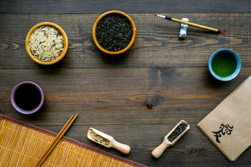 Chinese traditional symbols concept. Tea, rice, hieroglyph love, bambootabe mat, chopsticks, soy...