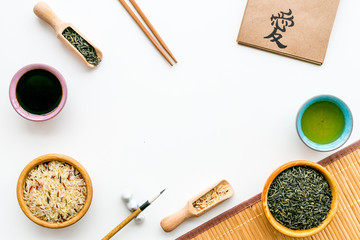 Chinese traditional symbols concept. Tea, rice, hieroglyph love, bambootabe mat, chopsticks, soy...
