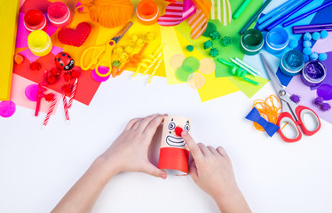 Children's hand making paper crafts