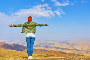 Beauty woman outdoors enjoying nature.