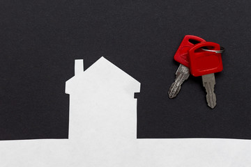 an image of a house with keys on dark background