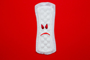 menstruation concept. a menstrual pad on red background