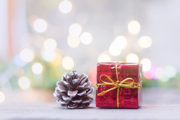 Close up of red gift box and pinecone for Christmas or New Year decoration background