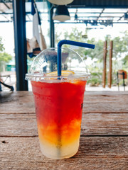 food background iced lemon tea placed on wooden table in coffee shop