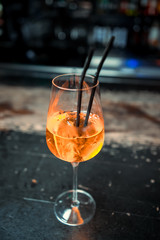 Ready alcoholic cocktail on the background of spice bars in a luxury bar, club, night club, restaurant, pub, evening, weekend