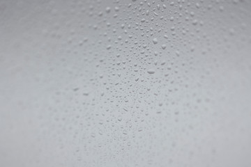 Rain drops on window water texture.
