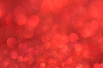 Red bokeh background defocused lights texture.
