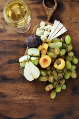Fototapeta na wymiar Appetizers table wine Fruit cheese wooden board Wine appetizers