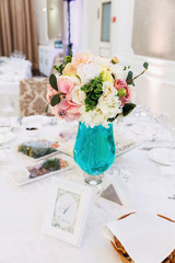 bouquet of flowers in a vase on wooden table