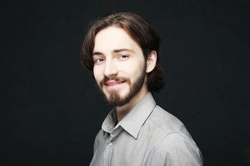 lifestyle and people concept:young man has excited expression, dresssed casually