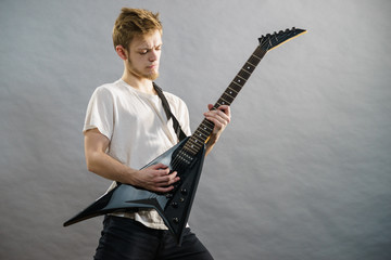 Man playing on electric guitar