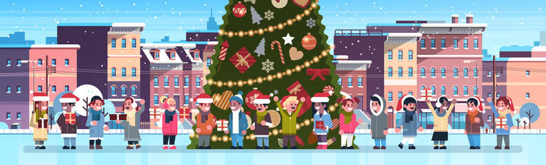 mix race children group near decorated fir tree city building houses winter street cityscape merry christmas happy new year concept flat horizontal banner vector illustration