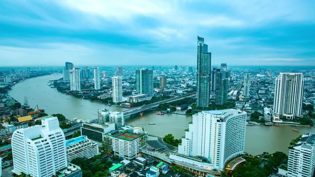 Cityscape day to night, transport background. Many building is the center of business communication in the city with skytrain and going speed light traffic on the road. wealth of business concept.