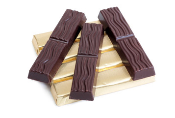 Coffee beans and chocolate cut on white background