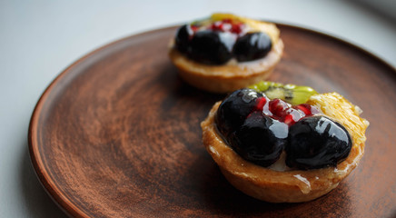 a tasty cakes with fresh fruits and berries on a plate