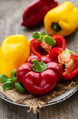 Plate with Bell peppers on a wooden background