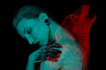 Gothic girl and wolf double exposure on black background. Werewolf concept. space for text