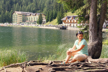 Mountain Lake Misurina. Beautiful tourist spot. female tourist.