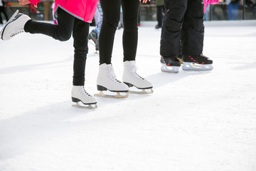 People ice skating on ice rink