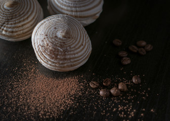 Coffee marshmallow with coffee, cacao and golden spoon. Warm, sweet moody food photo for coffee illustration