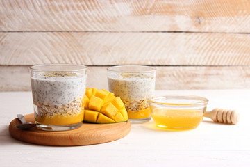 chia pudding with mango, granola and honey. Healthy dessert, proper nutrition, super food.