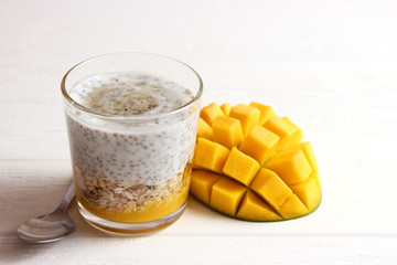 chia pudding with mango, granola and honey. Healthy dessert, proper nutrition, super food.