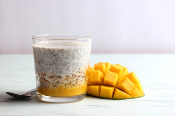 chia pudding with mango, granola and honey. Healthy dessert, proper nutrition, super food.