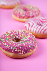 Donuts  on a pink background.