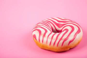 Donut on a pink background.