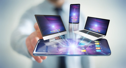 Modern devices connected in businessman hand 3D rendering