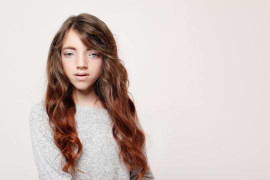 lifestyle and people concept: litle girl kid with long curly hair