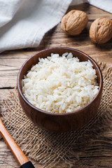Fototapeta na wymiar White boiled rice in a wooden bowl. Rustic style.