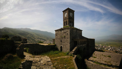 Panoramic view to Gjirokastra castle with the wall, tower and Clock, Gjirokaster, Albania