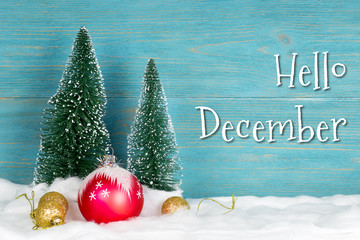 hello december, text over blue wooden planks with xmas decorations © MasterSergeant
