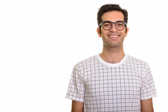 Portrait of young happy Persian man smiling