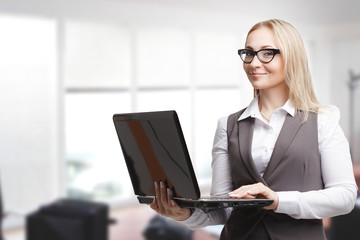 The concept of business, technology, the Internet and the network. Business woman is working on computer