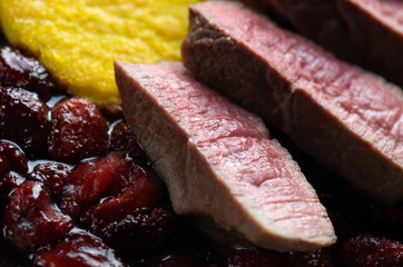 Beef steak with strawberries sauce