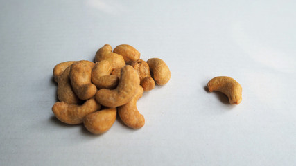 Fototapeta na wymiar Cashew nuts roasted on white background.