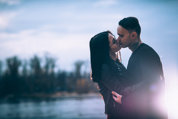 Obraz premium man and woman near the river autumn