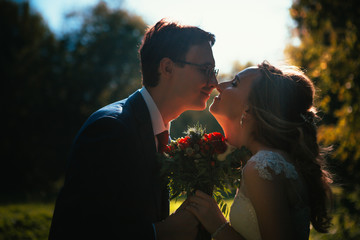 bride and groom on background summer forest