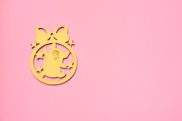 christmas wooden chinese pig on pink background. New year 2019 greeting card with empty space for image or text