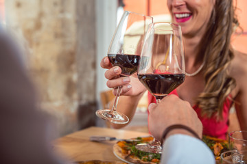 Close-up of a couple toasting wine glass
