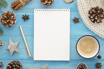 Blank notebook mock-up. Rustic blue wooden planks with anise star, pine cones. Christmas, winter,new year,Xmas Holiday seasonal greetings card. Trendy flat lay design to do