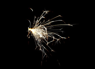 Fototapeta premium Ignited sparkler isolated on black background with clipping path