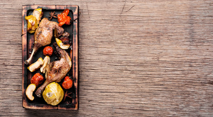 Duck legs with vegetable garnish