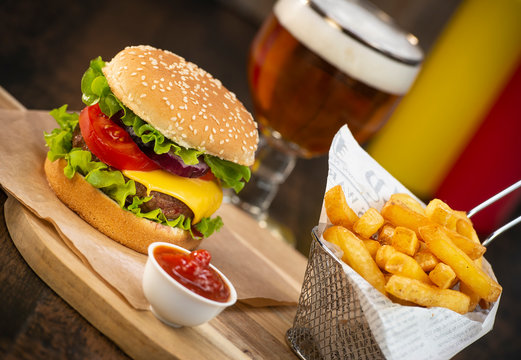 Burger with French fries cutlet with cheese and tomato